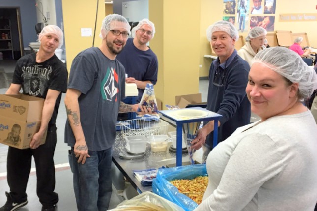Perfect Fit Tank Liners Volunteering at Feed My Starving Children